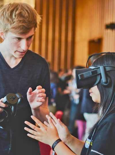 Photograph of students using a VR headset as part of a design workshop