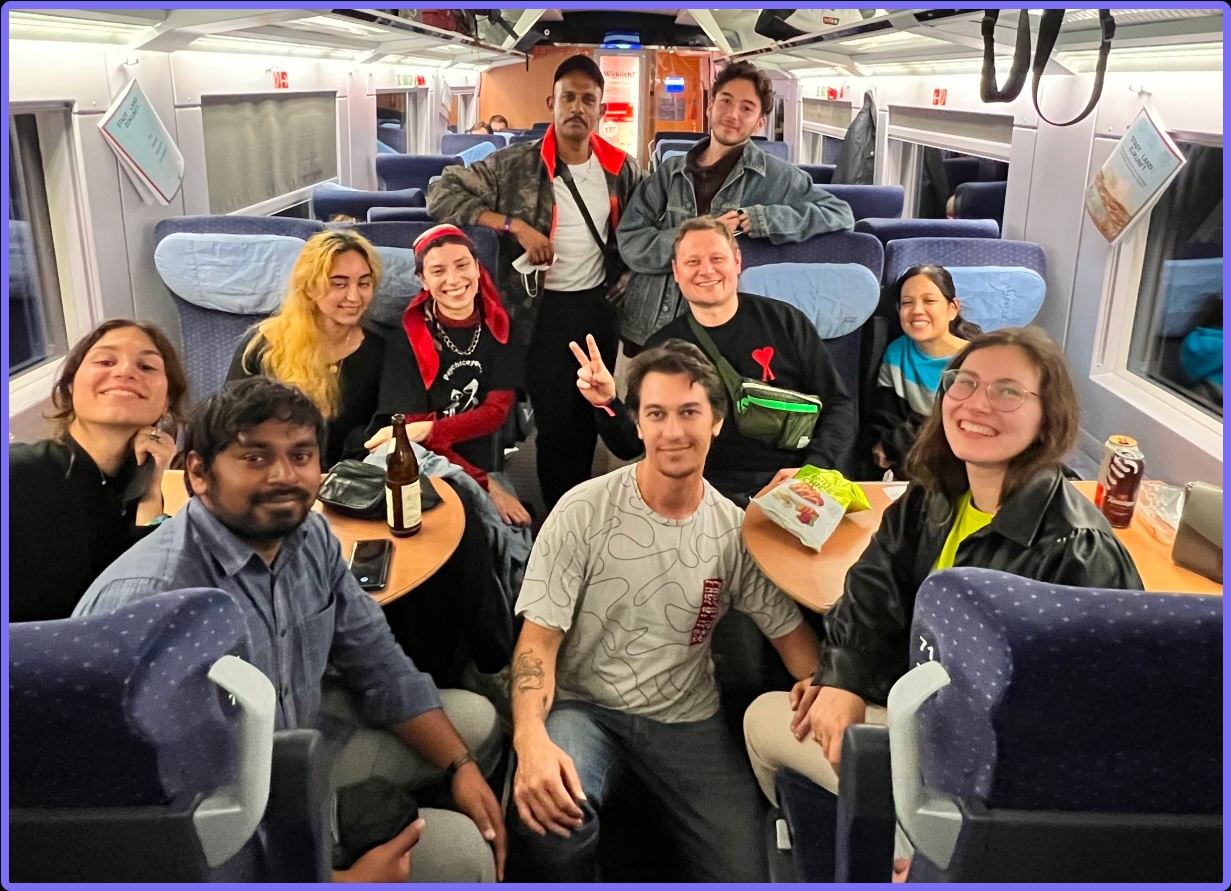 Photograph of students on a train during an international field trip to Dutch Design Week